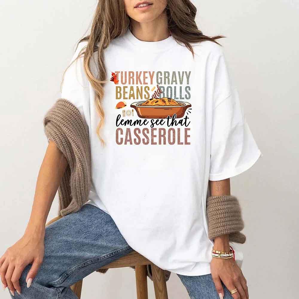 White crewneck T-shirt with colorful Thanksgiving casserole graphic on model