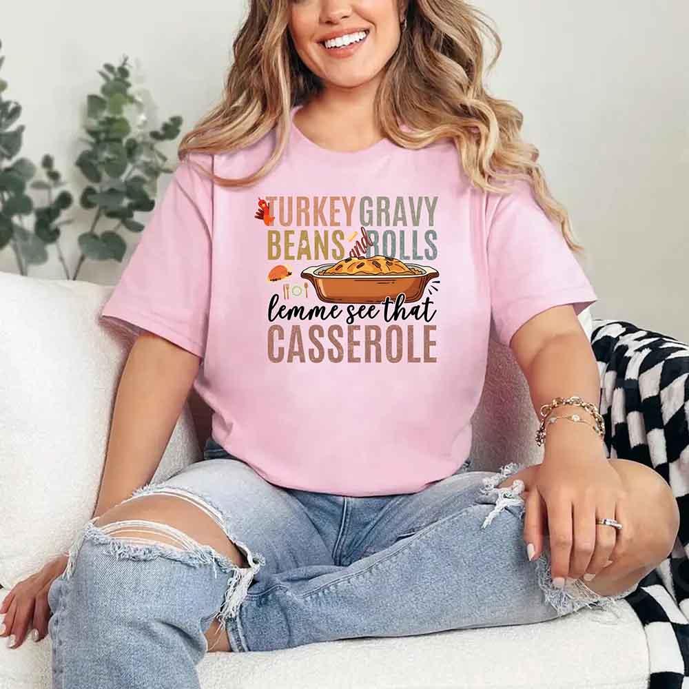 Pink graphic T-shirt with Turkey gravy beans and rolls casserole front print
