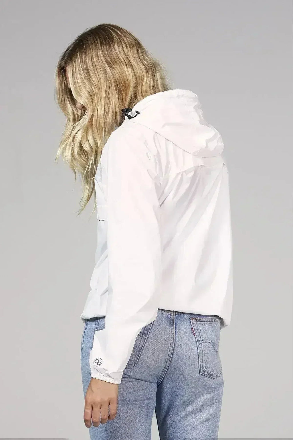 White quarter-zip rain windbreaker jacket, back view with hood
