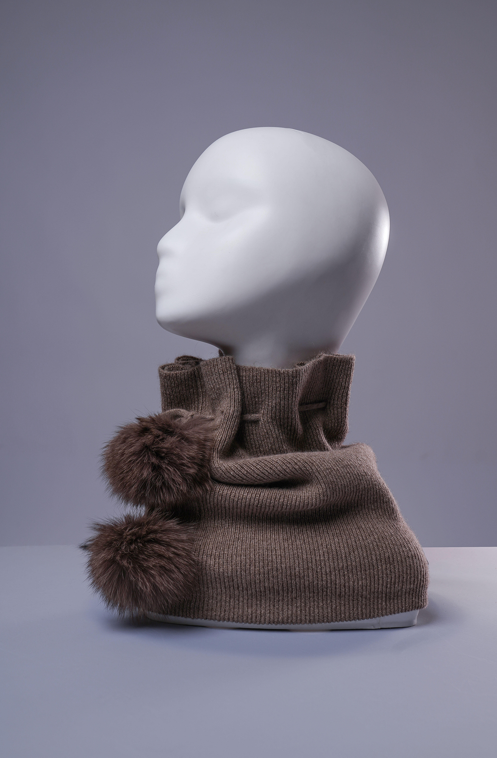 Brown cashmere neck warmer and beanie with fur pom-pom accents