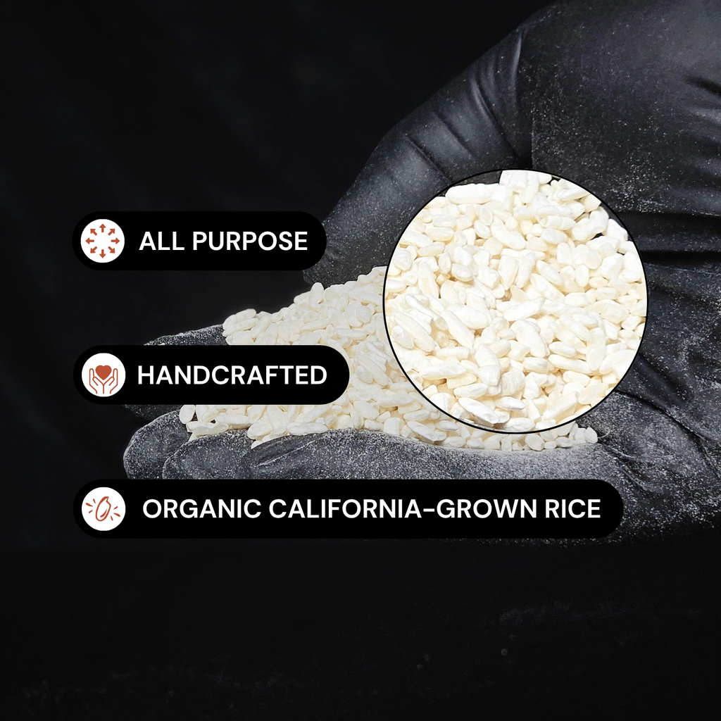 Rice koji grains with spoonful, inset magnified view of white rice pieces