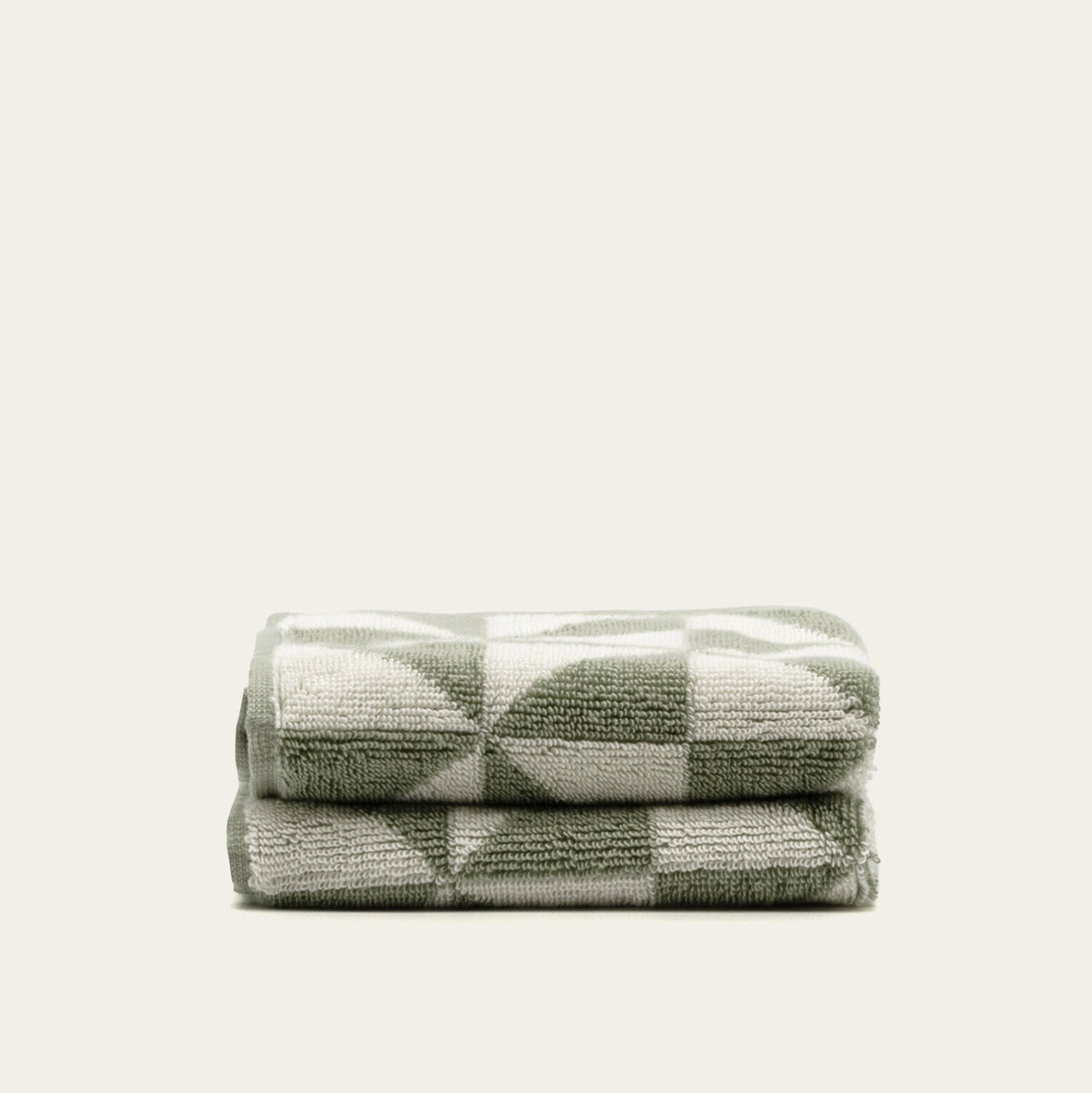Sage and ecru check-pattern cotton towels, folded into a compact two-stack set.