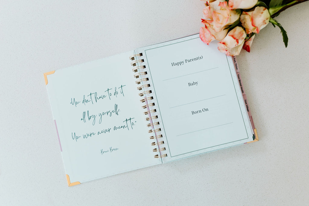Open postpartum planner with handwritten notes and section headings Baby and Born On