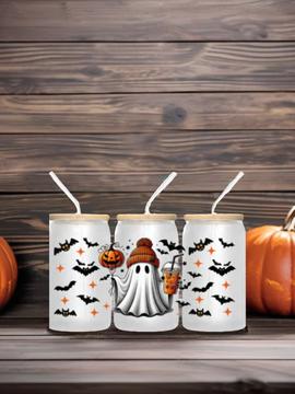 Three Halloween ghost glass tumblers with clear straws and beige lids, bat pattern