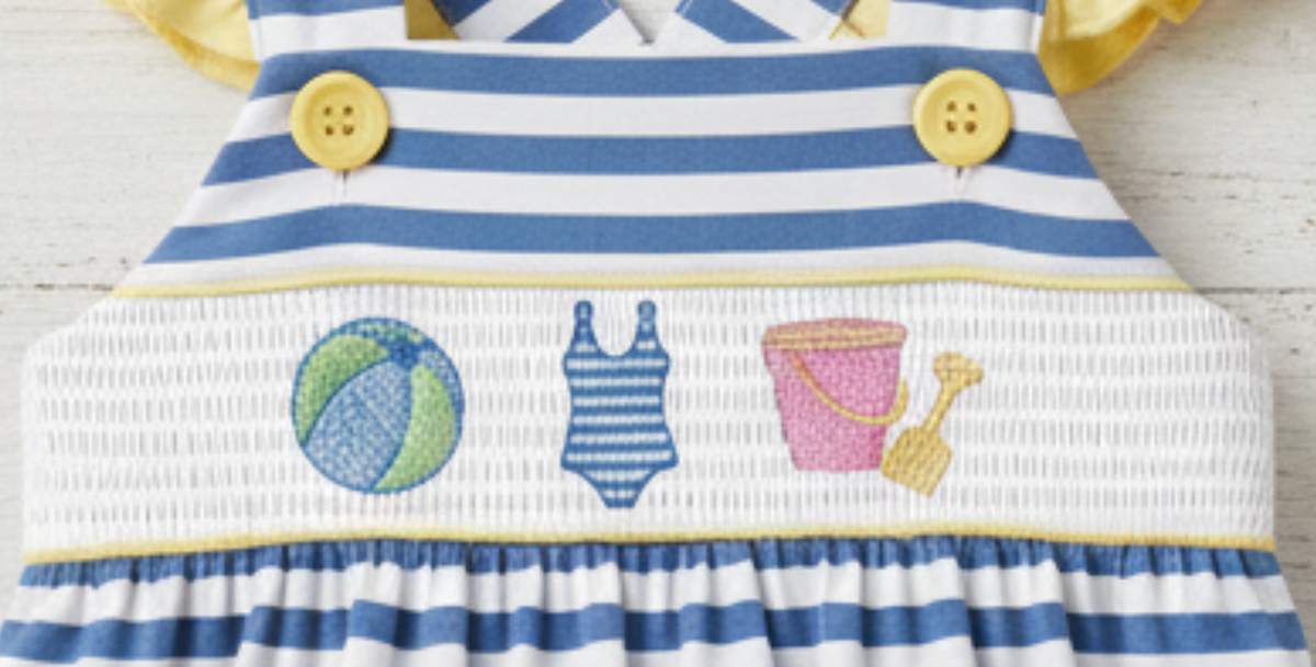 Embroidered seaside bodice with beach ball and summer icons, blue striped skirt