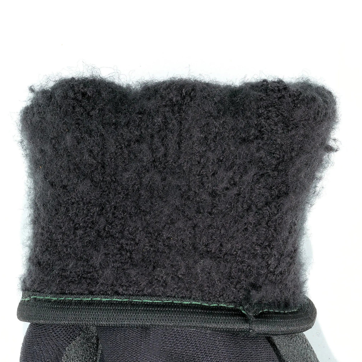 Black glove cuff close-up, fuzzy insulated lining at wrist seam
