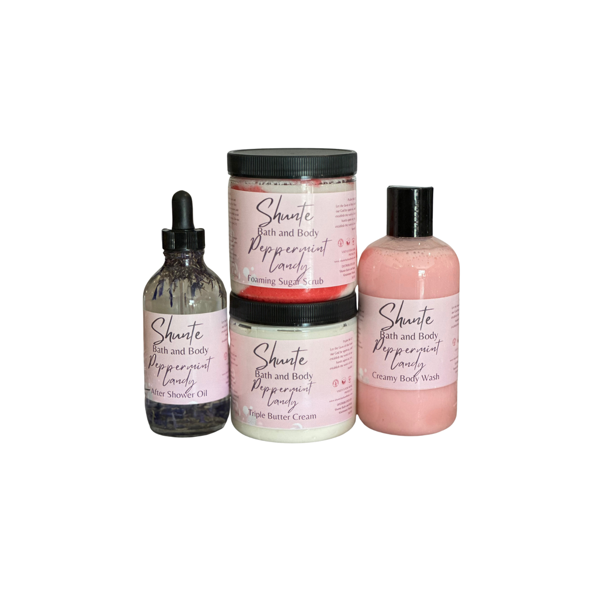 Bath and body gift set bundle with peppermint: pink jar, lotion bottle, and oil bottle.