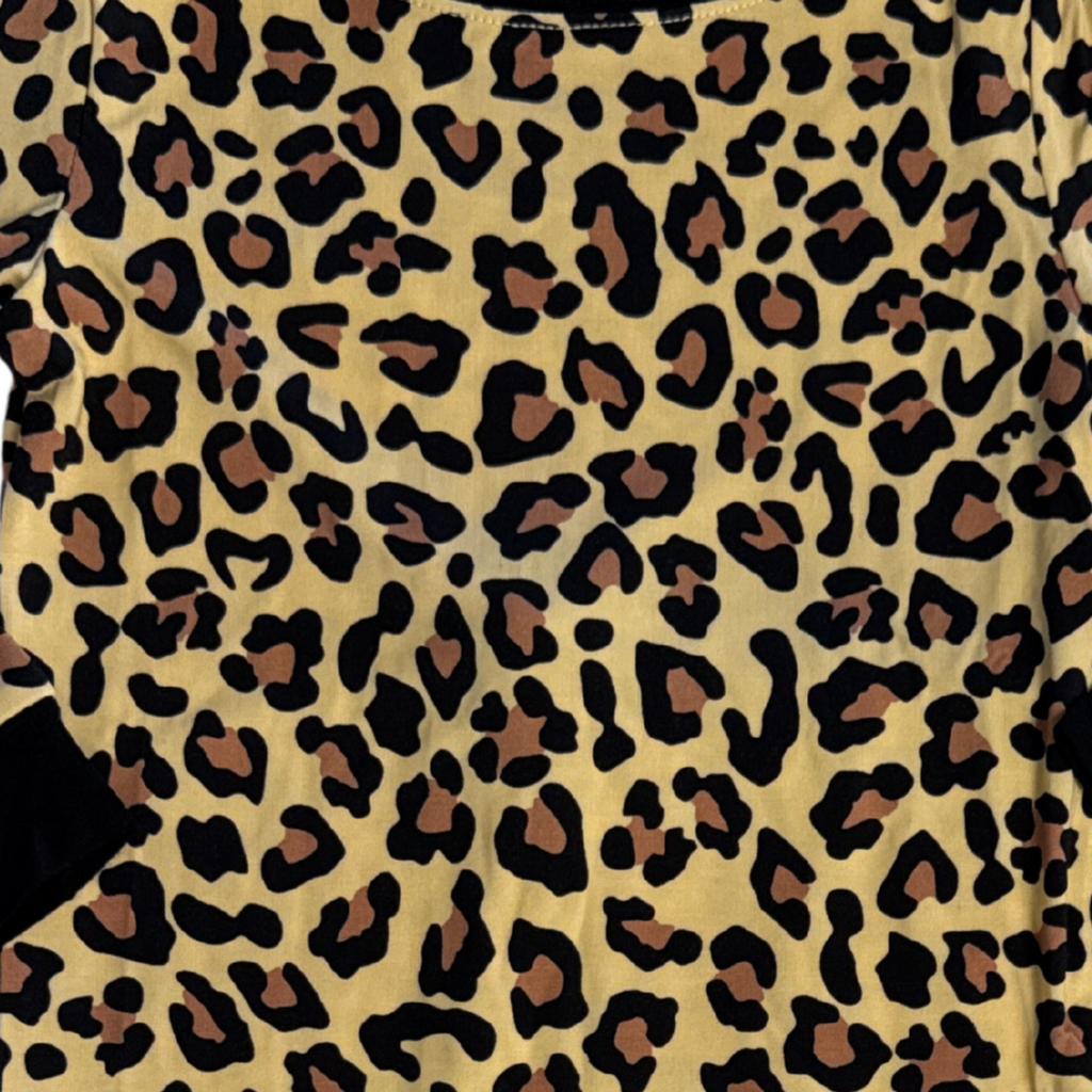 Close-up of leopard print pajama fabric in black and tan