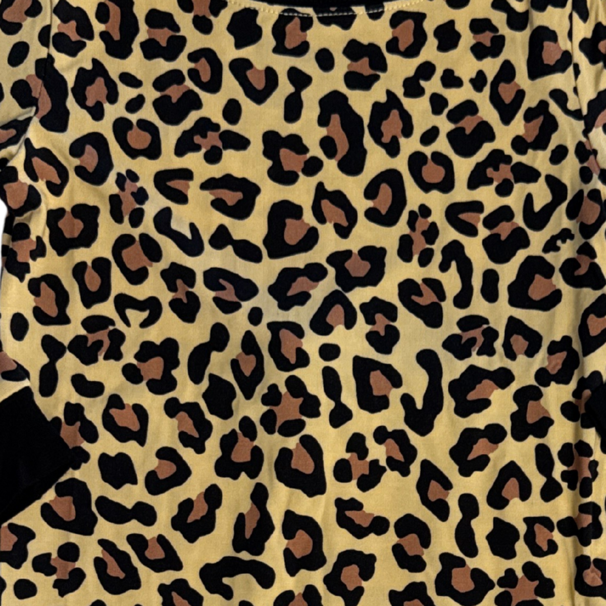Close-up of leopard print pajama fabric in black and tan