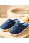 Blue knitted slip-on critter slippers with plush lining and white rubber sole