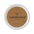Leather protector balm in round tin lid, labeled "Leather Balm" "Double Oak"