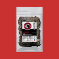 Pepper beef jerky bag with dark peppered strips, resealable package.