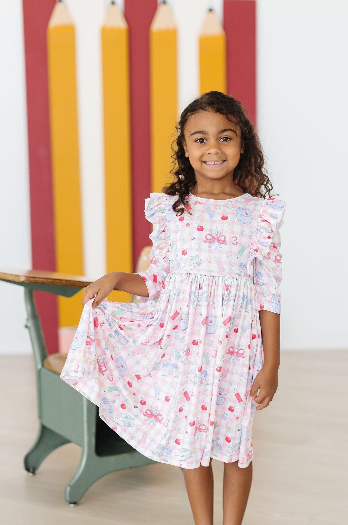 White printed 3/4 sleeve ruffle twirl dress with layered skirt and bow accents