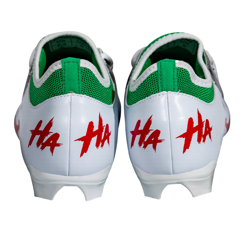 Pair of white-and-green cleats with red HA markings on heel and back