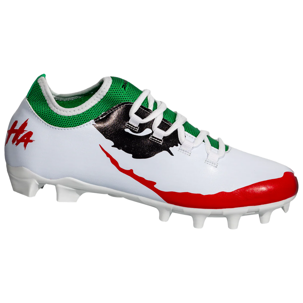 White cleat with green collar, black silhouette graphic, red outsole, and visible studs