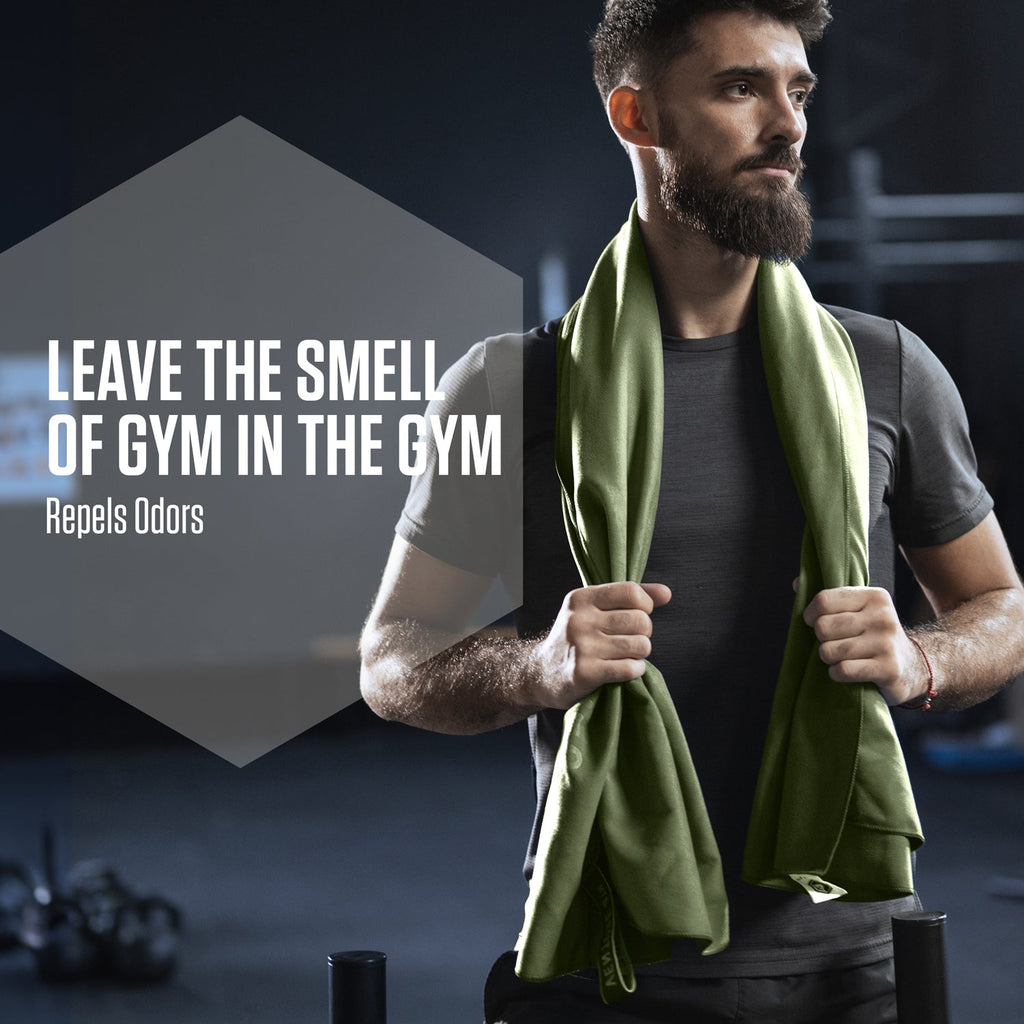 Olive green microfiber travel towel draped over a man’s shoulders