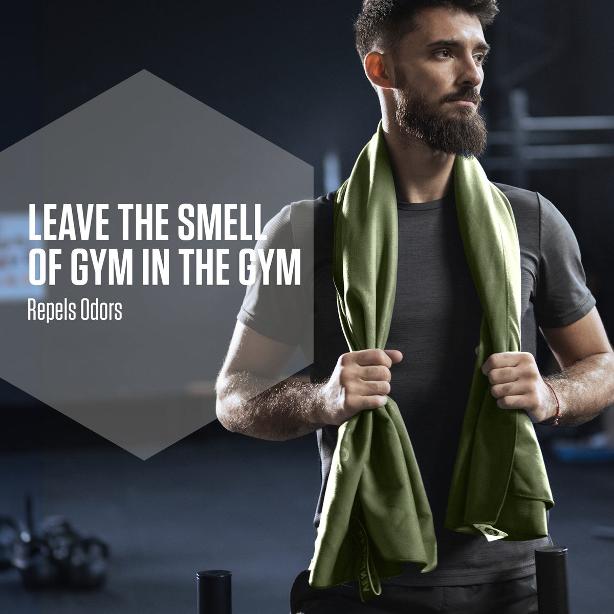 Olive green microfiber travel towel draped over a man’s shoulders