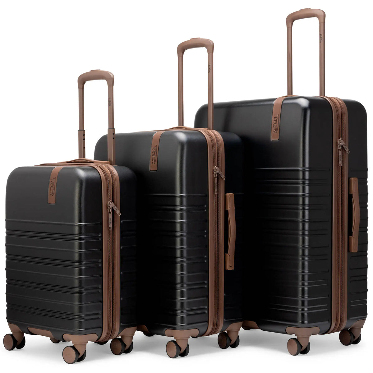 3-piece hardside spinner luggage set in dark finish, tan accents and upright handles