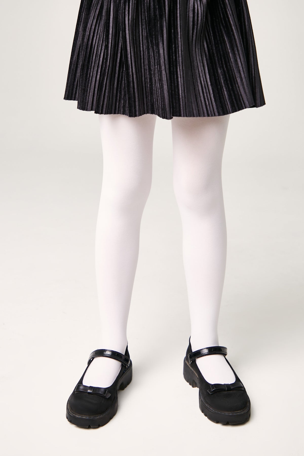 Girls 60 den velour tights in light color, full-length view with smooth matte finish