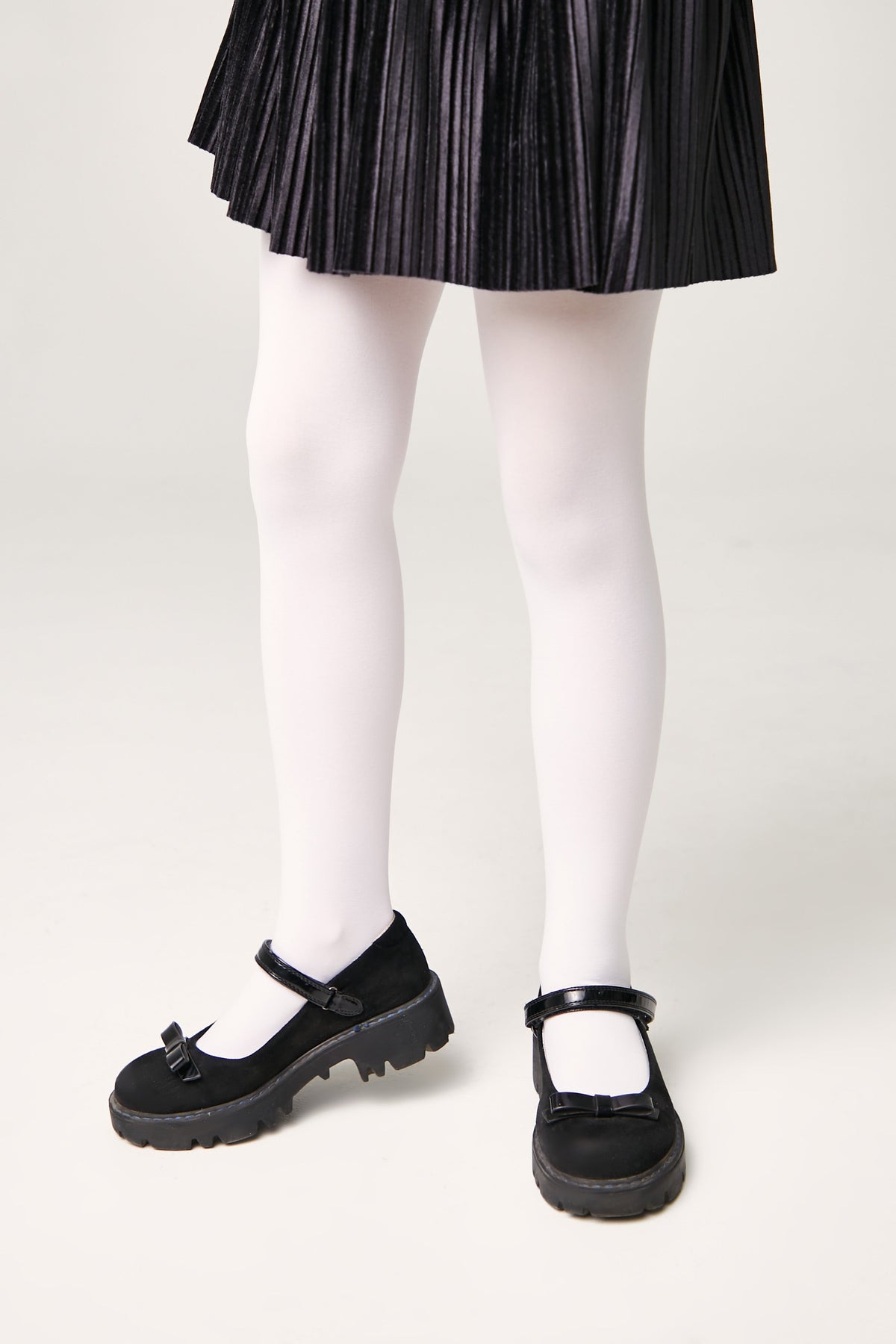 Girls 60 den velour tights in light color, smooth matte finish, full length