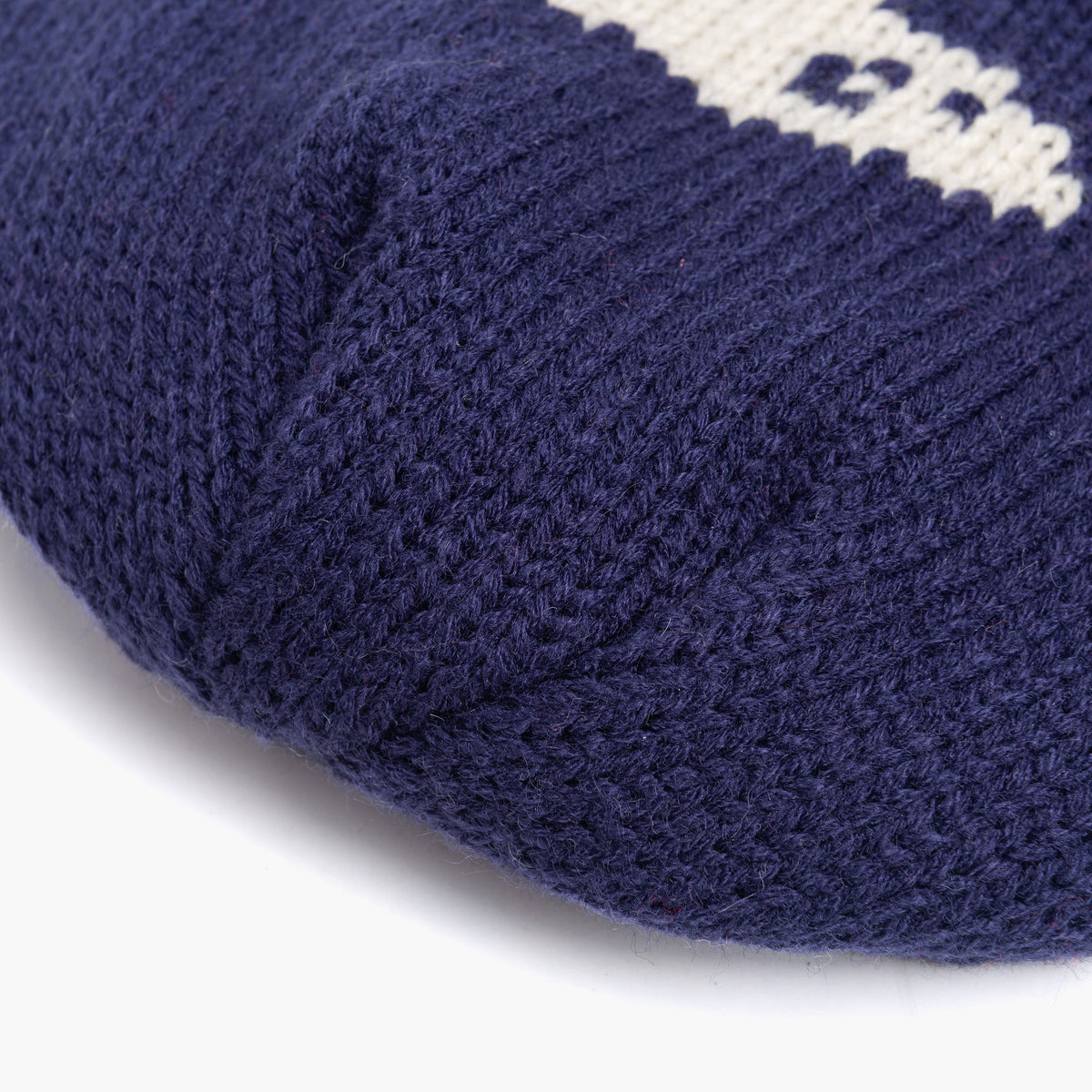 Navy knit beanie cuff with ribbed hem close-up