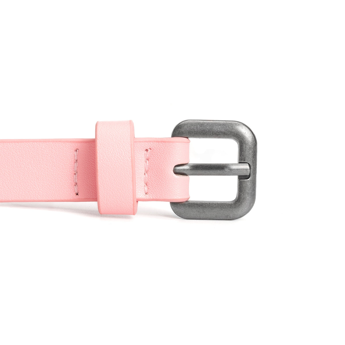 Kids leather belt close-up: light pink strap with silver buckle and keeper