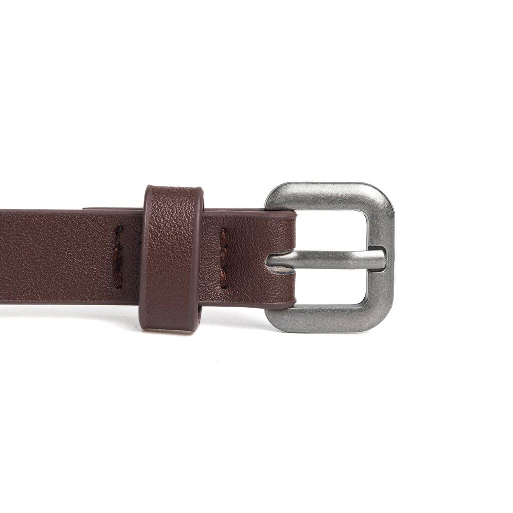 Kids leather belt close-up: dark brown strap with silver buckle and stitched tab