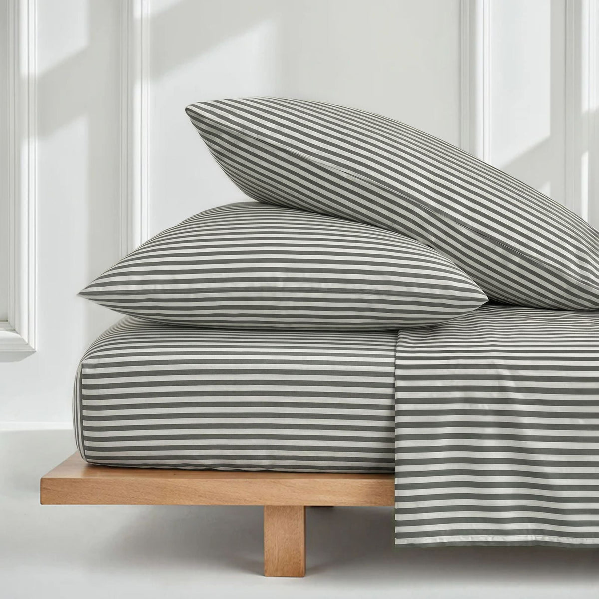 Green-and-white striped sheet set with pillowcases and duvet