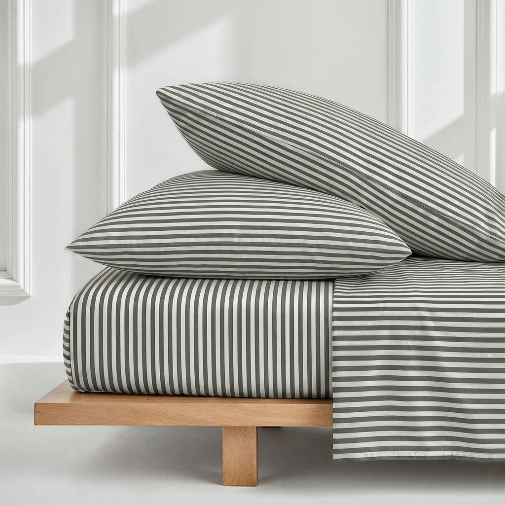 Stripe sateen bedding set with two pillows and duvet, white and muted green.