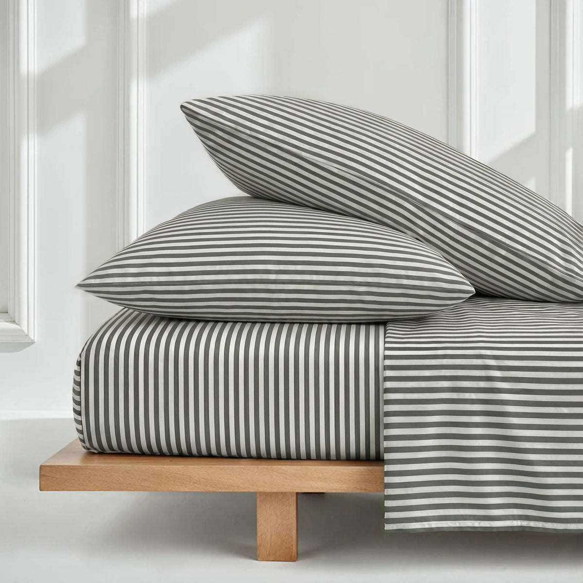 Stripe sateen bedding set with two pillows and duvet, white and muted green.