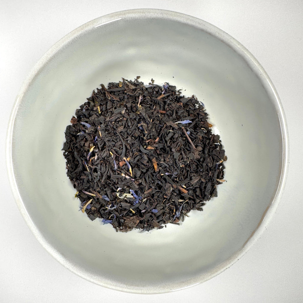 Loose leaf black tea leaves in a bowl