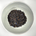 Loose leaf black tea leaves in a bowl