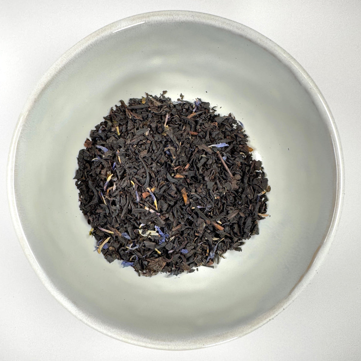 Loose leaf black tea leaves in a bowl
