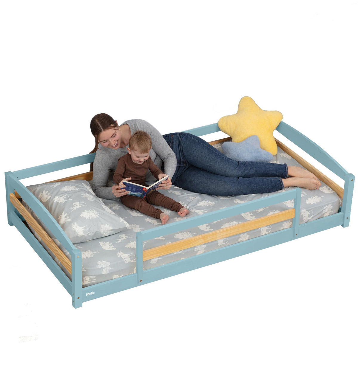 Light blue twin floor bed with safety guardrails and padded bedding with star pillow