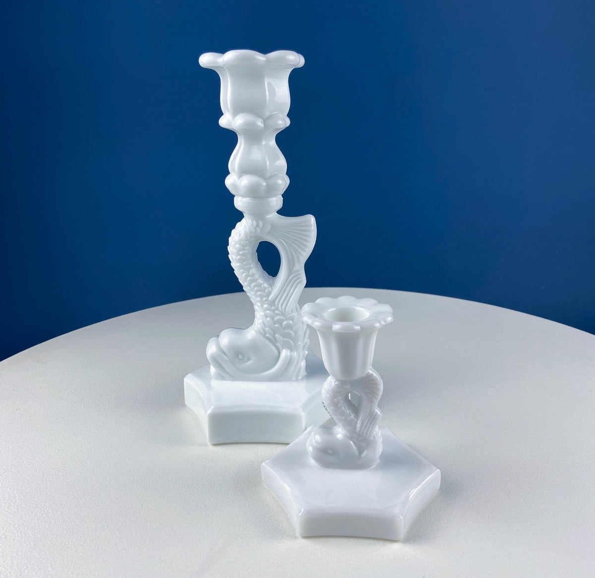 White milk glass dolphin candle holder on block base, set of two