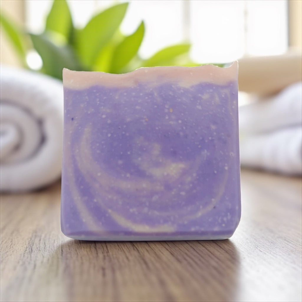 Square purple tallow soap bar with smooth top and swirl-like lighter accents