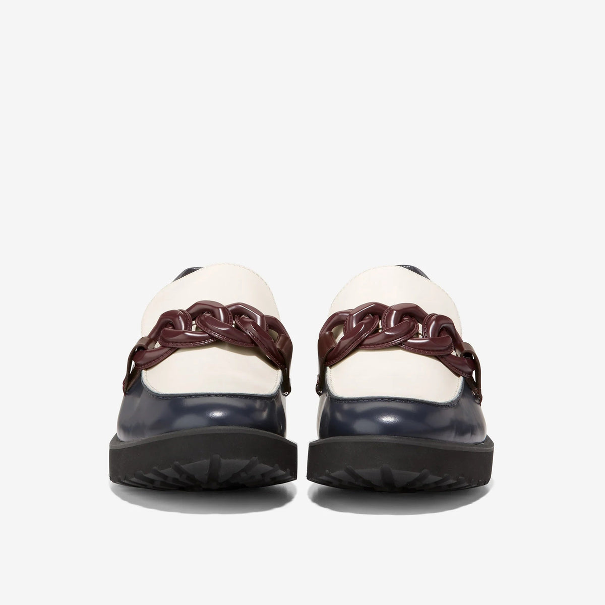 Women's loafers with white heel caps, navy uppers, burgundy chain hardware, chunky soles