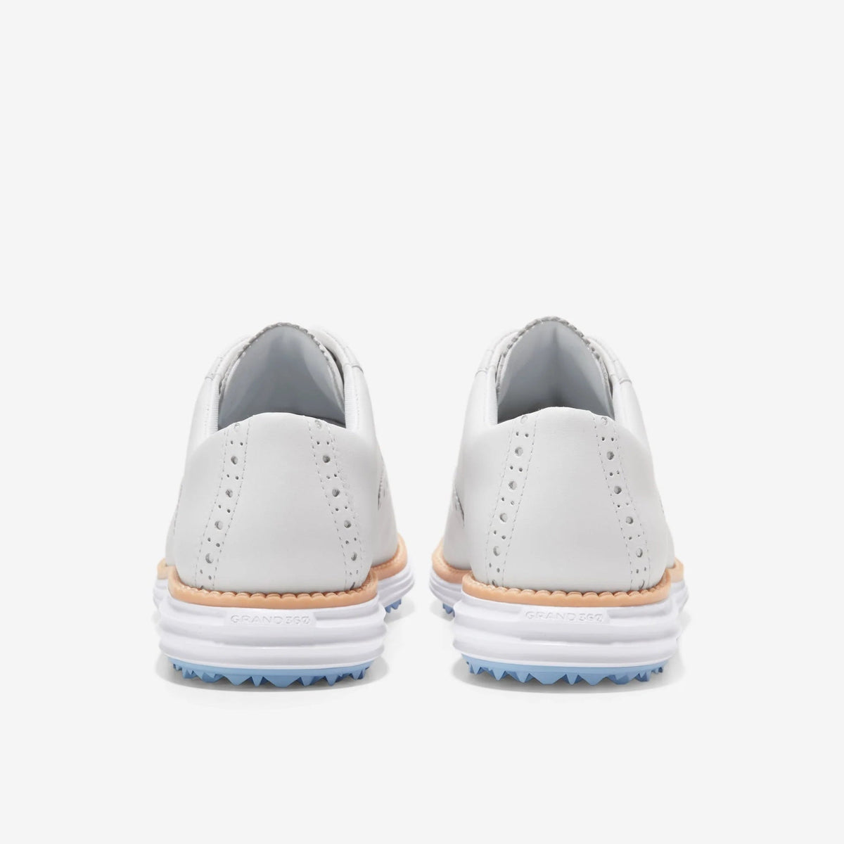 Pair of white waterproof golf oxford shoes, padded heel, blue tread outsole