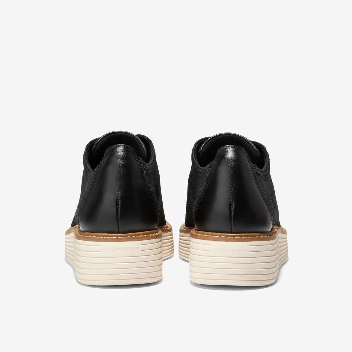 Black heel and back of lace-up Oxford with cream platform outsole