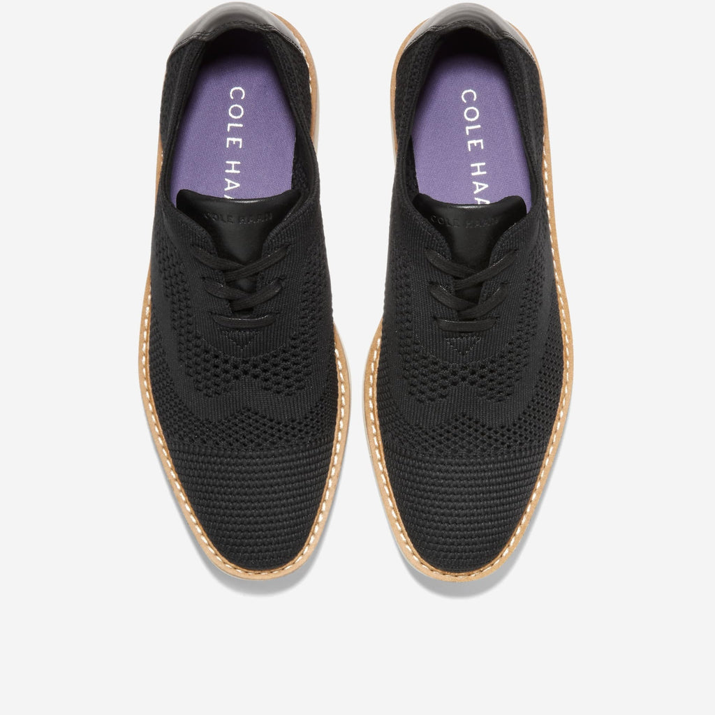Black knit lace-up Oxford showing 'COLE HAAN' lining with cream contrast outsole
