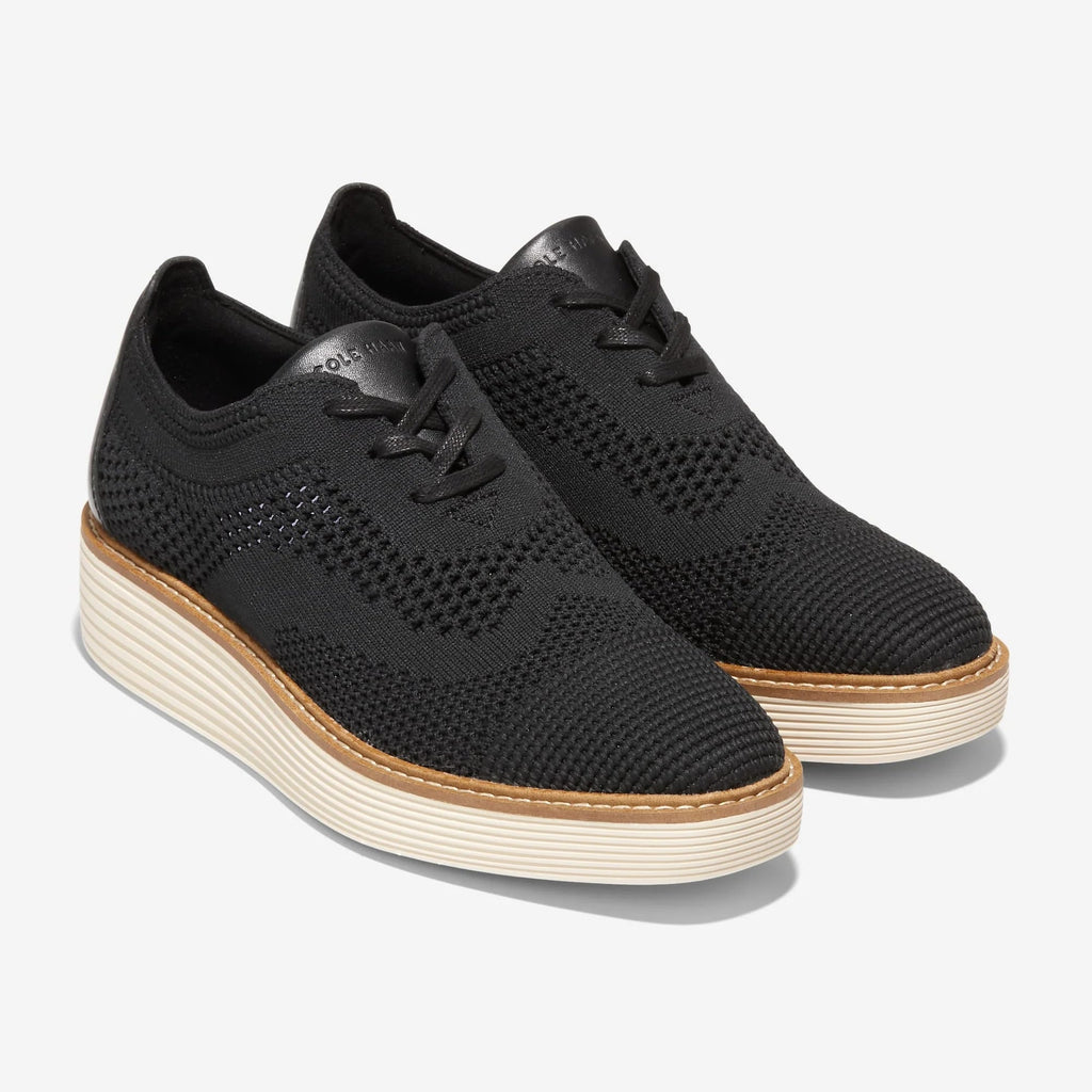 Black knit lace-up Oxford with wingtip perforations and cream platform sole, side view