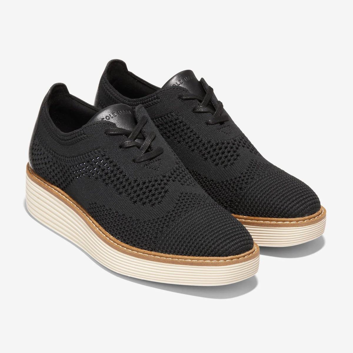 Black knit lace-up Oxford with wingtip perforations and cream platform sole, side view
