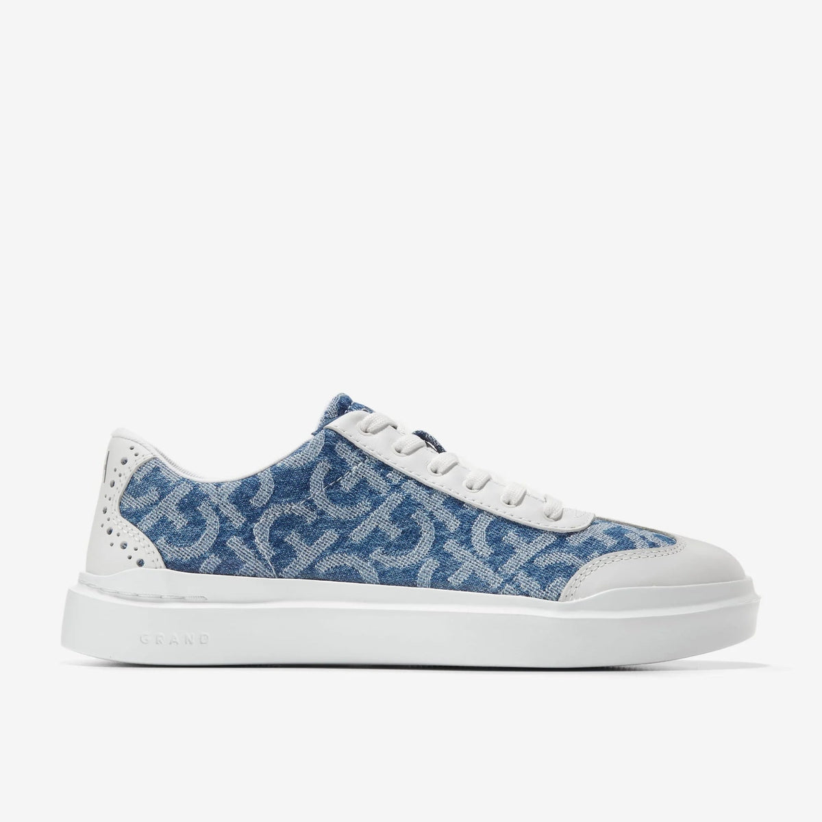 Women's canvas T-toe sneaker, blue patterned uppers with white laces