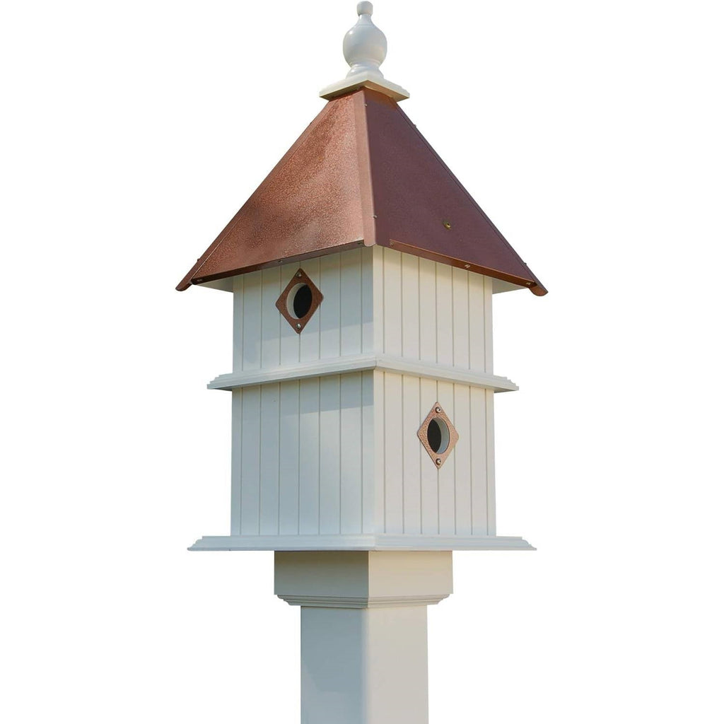 Two-story birdhouse with white siding, copper-tone roof, two diamond entrance doors