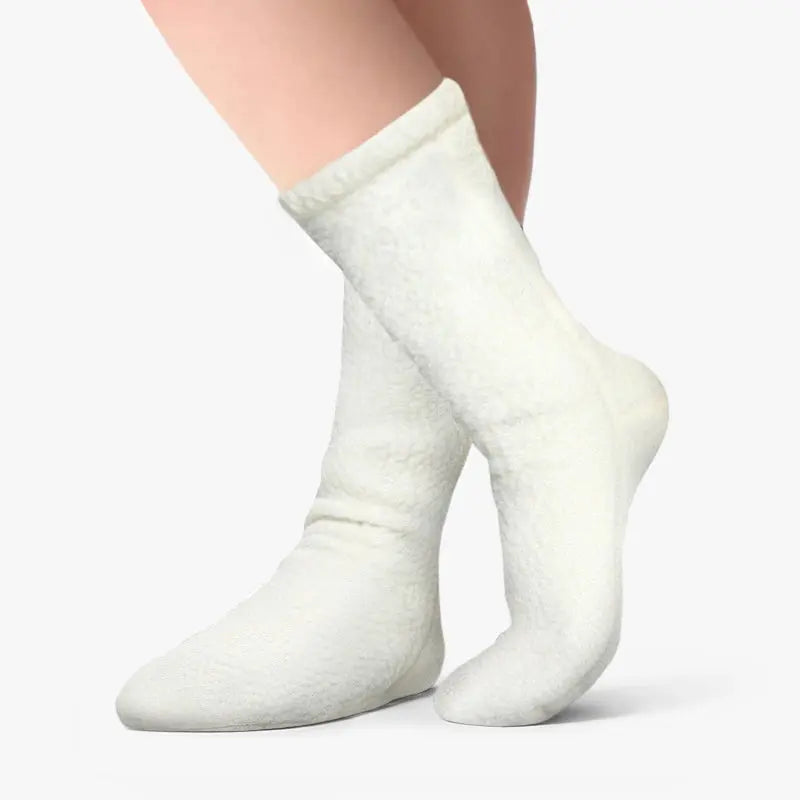 Cream fleece crew socks on feet, textured knit upper