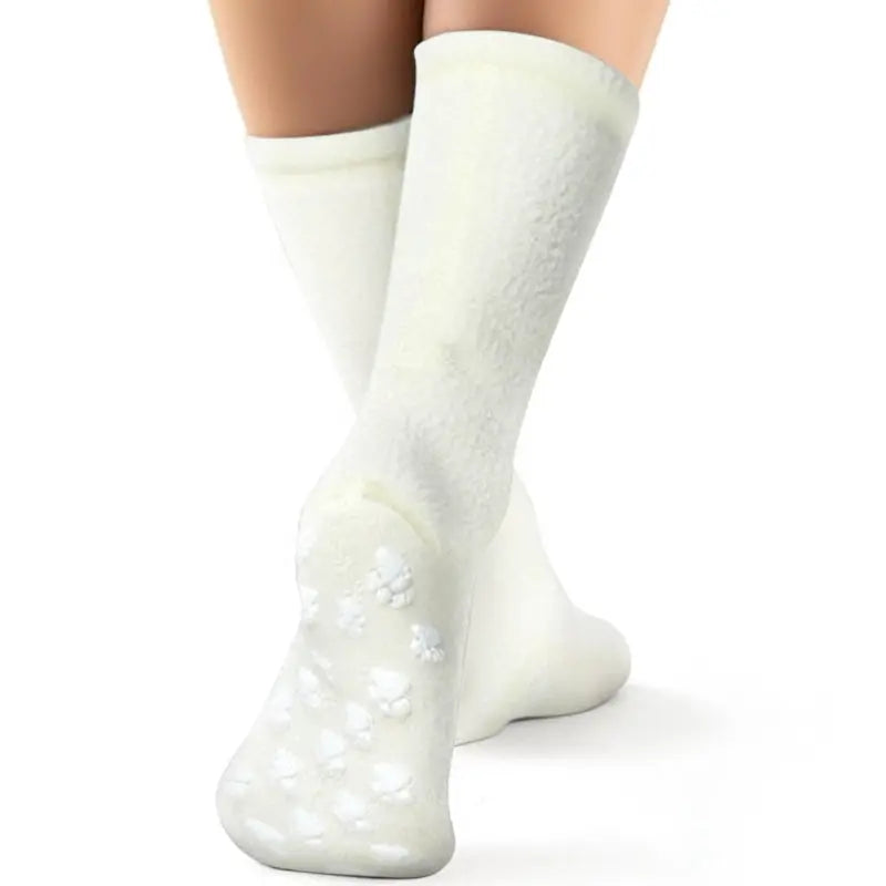 Cream fleece crew socks with grippy dotted sole pads at heel and toe