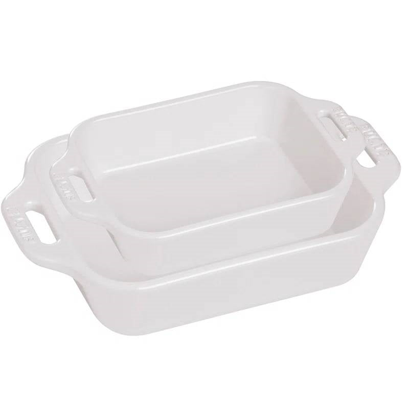 White ceramic casserole dish with side handles and rectangular serving shape