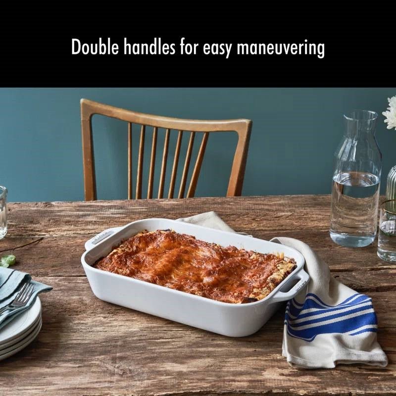 White ceramic baking dish with double side handles for easy carrying