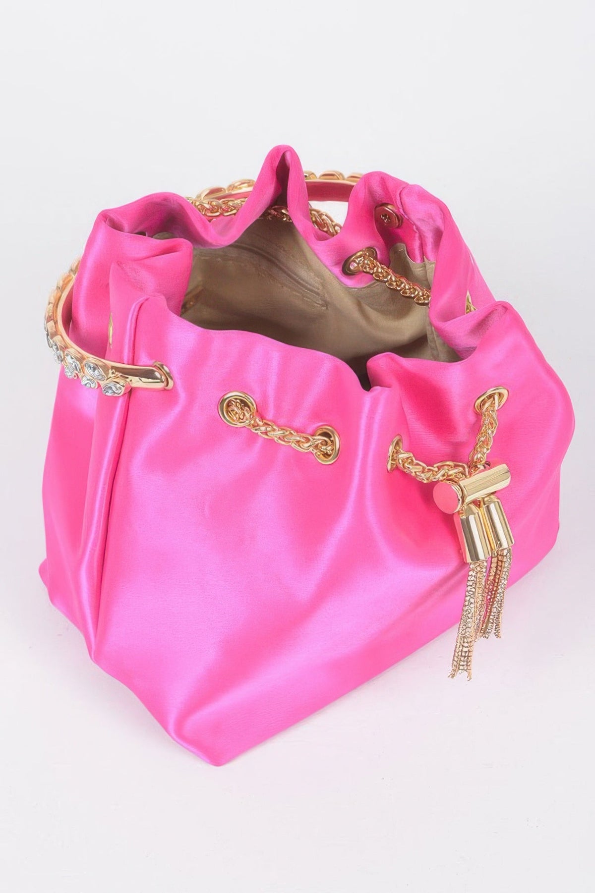 Fuchsia satin bucket bag with open top, gold chain drawstring, and tassel pulls
