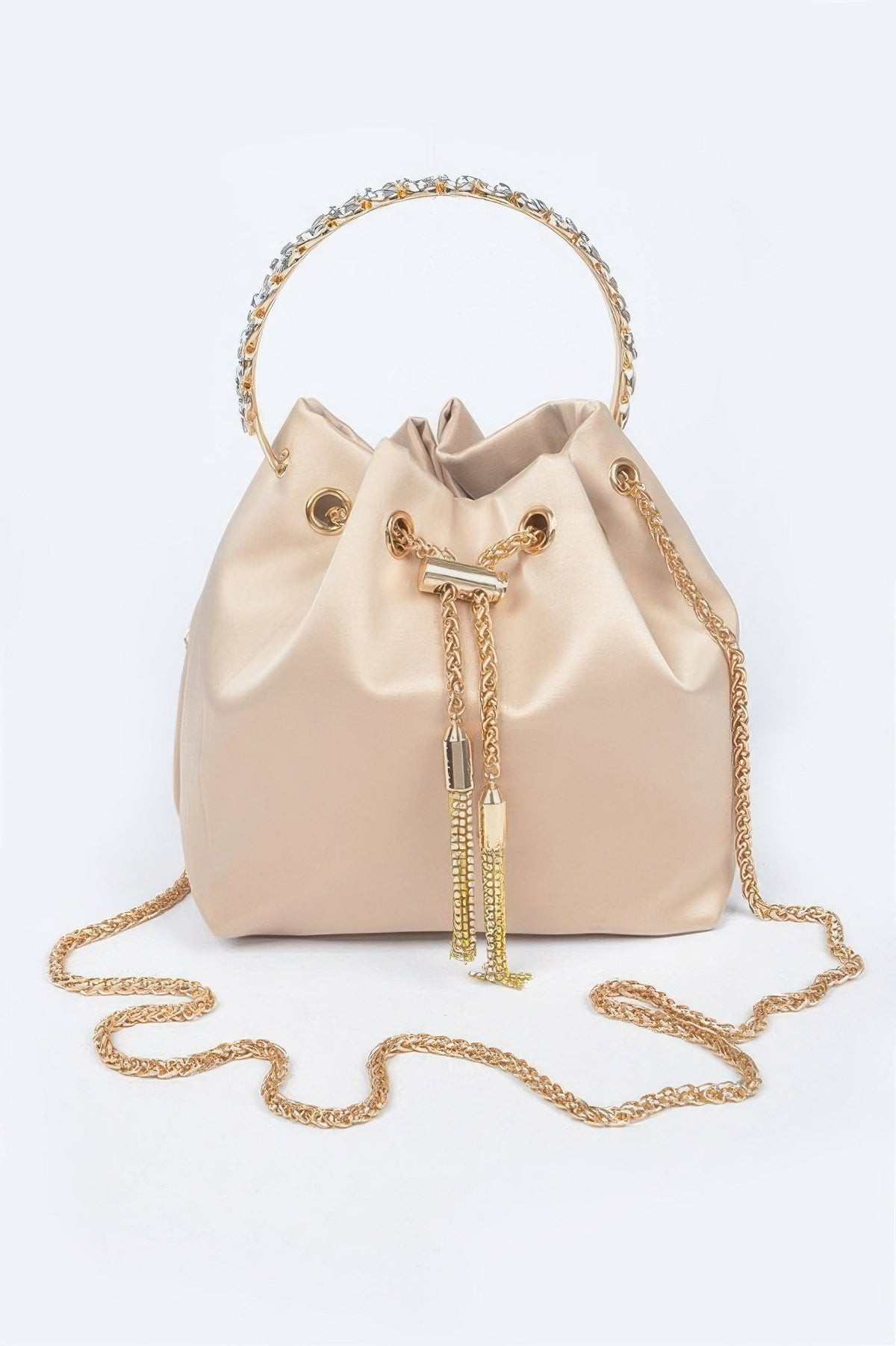 Nude satin bucket bag with rhinestone top handle, gold drawstring, and chain strap